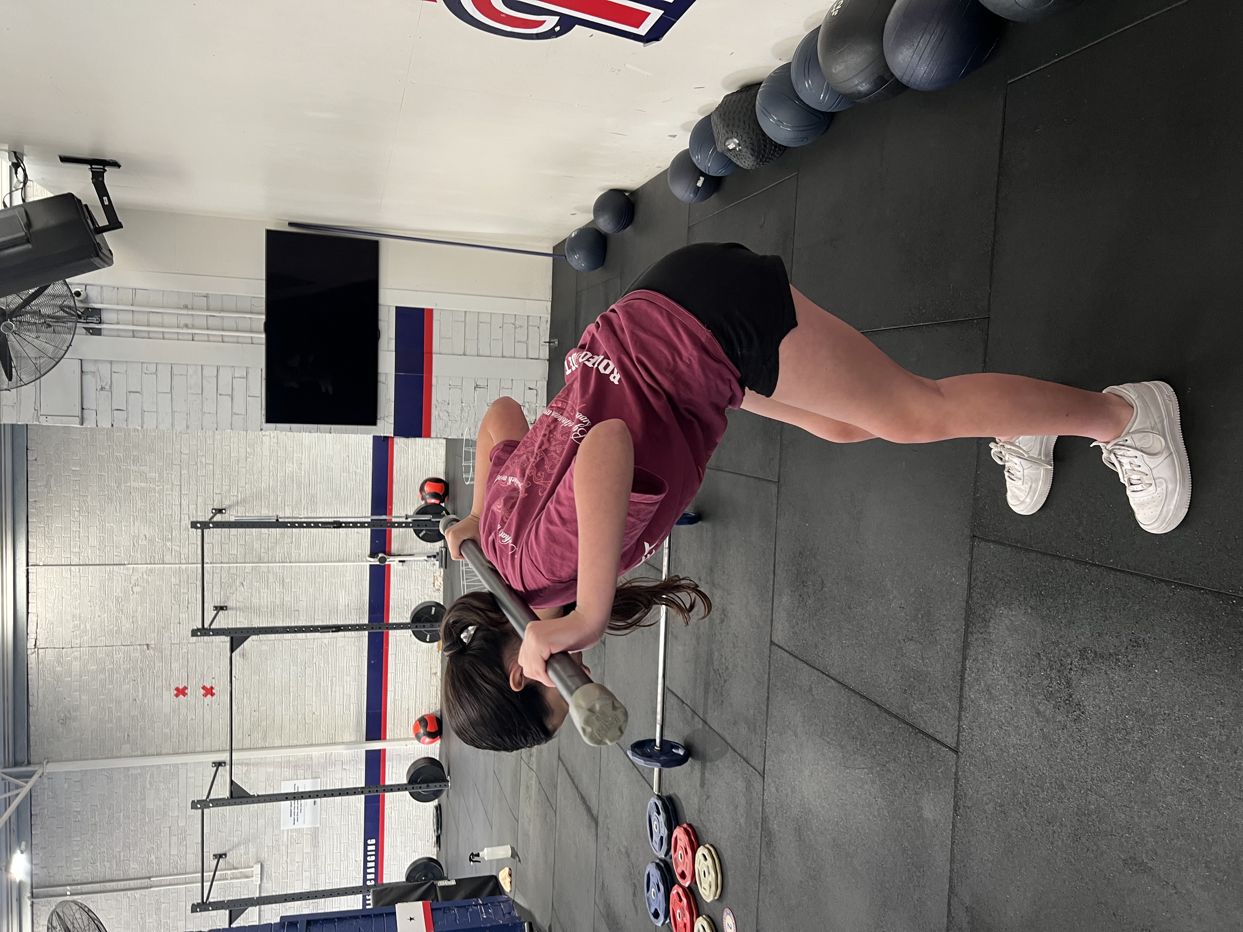 Teen practising barbell technique at The Strength Journey