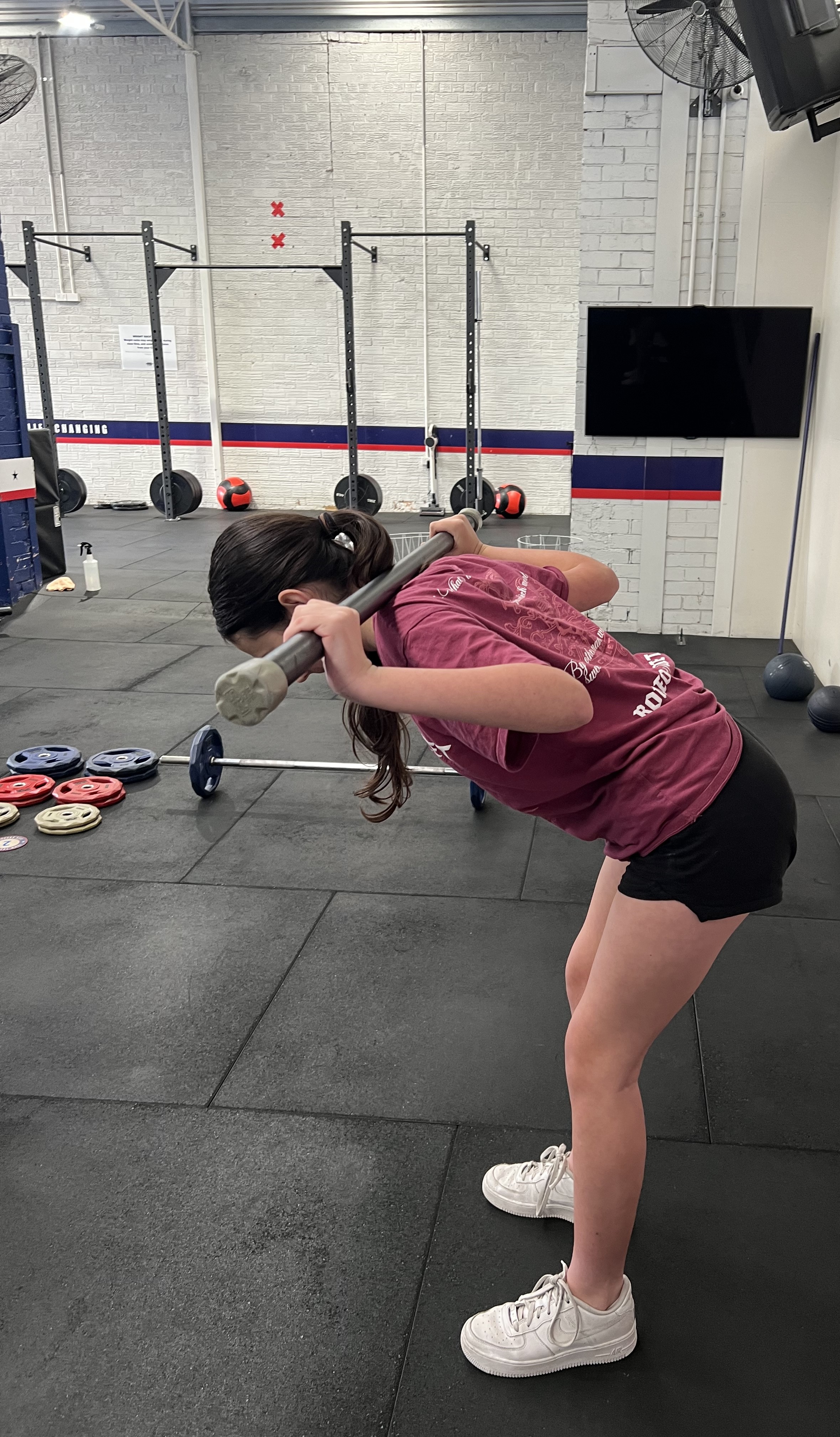 Teen practising barbell technique at The Strength Journey